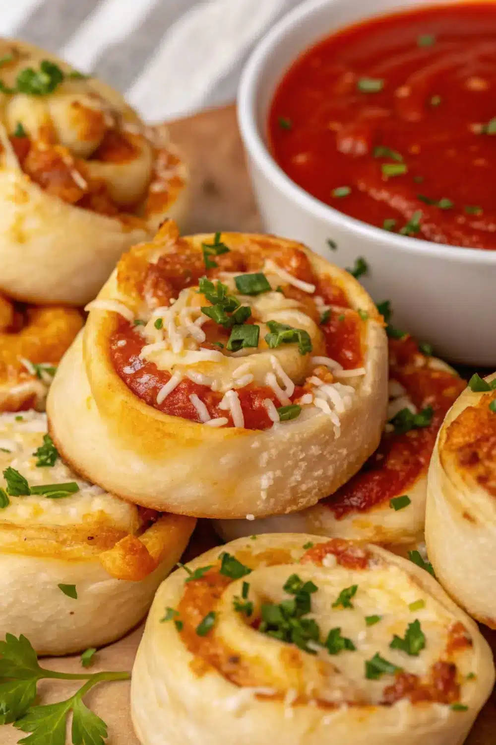 Cheesy pizza pinwheels with melted cheese and pepperoni rolled to perfection.