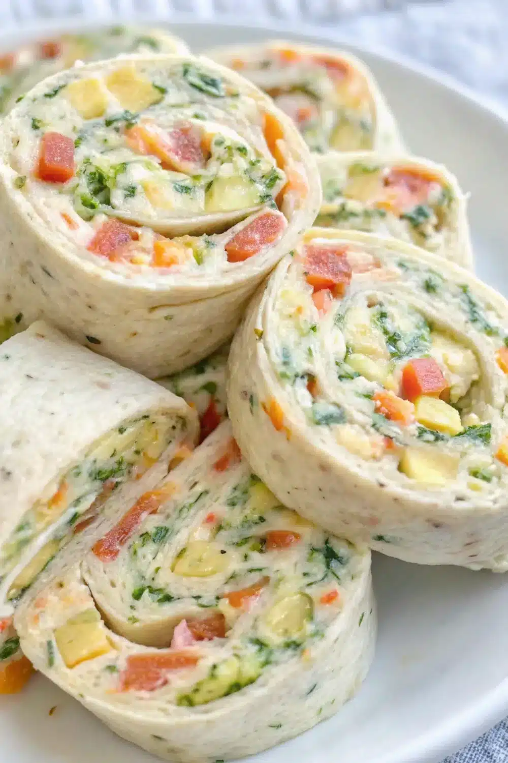 Colorful veggie pinwheels showcasing layers of fresh, crunchy vegetables.