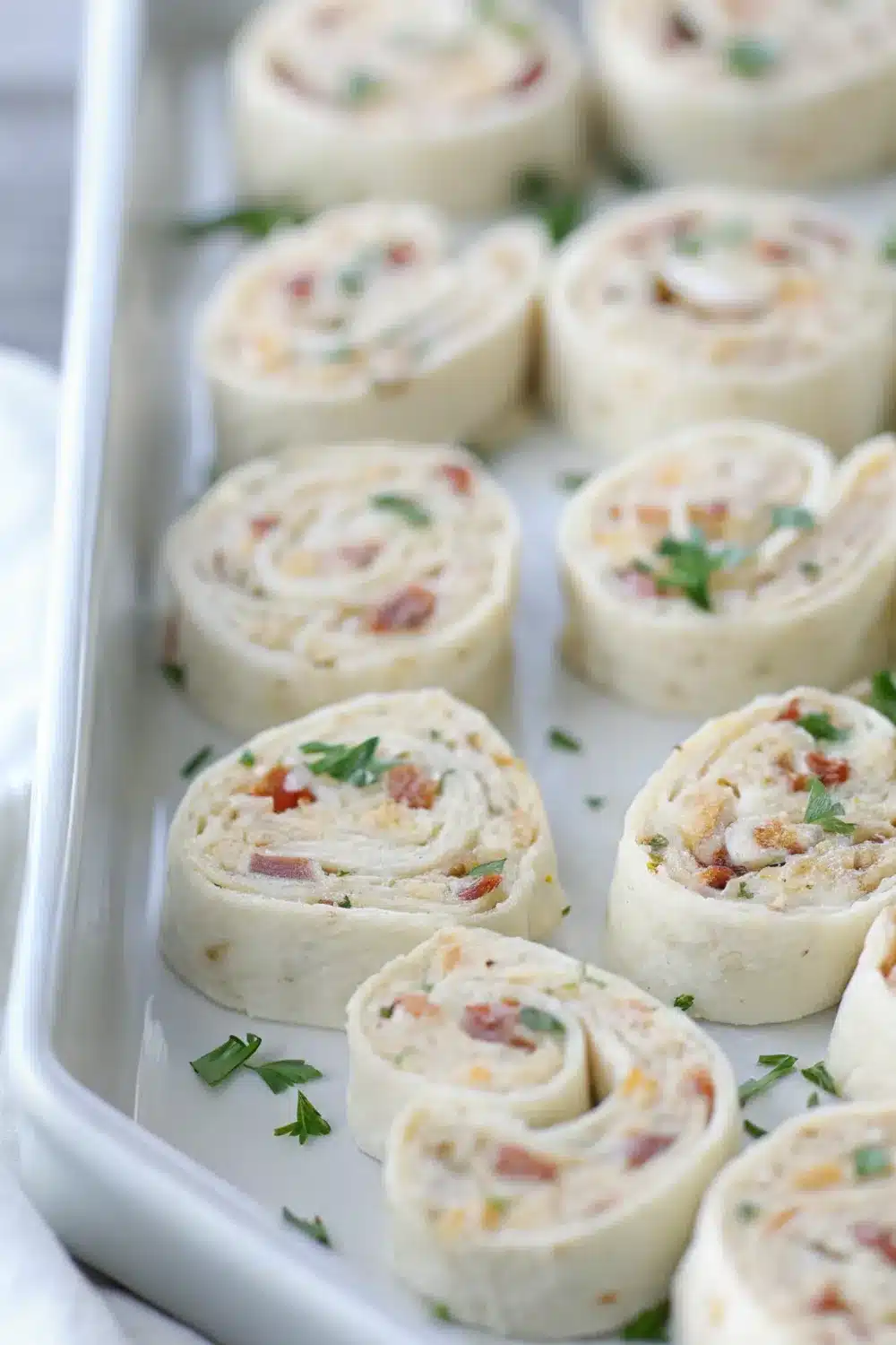 Mouthwatering bacon cheddar ranch pinwheels with layers of cheesy and savory goodness.